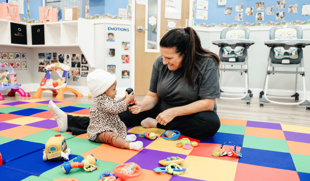 Teacher and child at The Growing Years Cary five-star rated child care center in Cary, NC